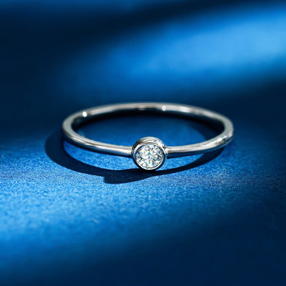 Simple round moissanite ring