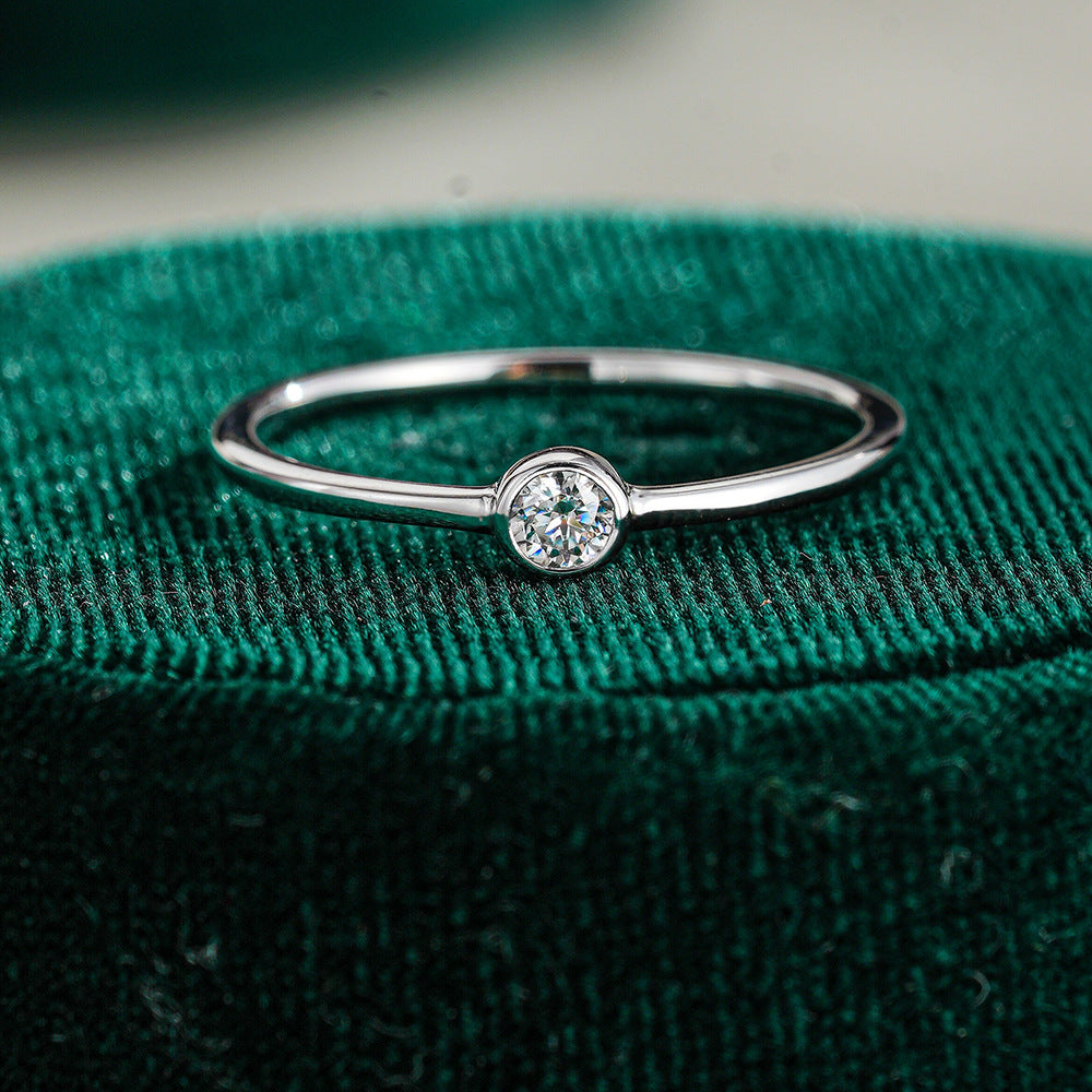 Simple round moissanite ring