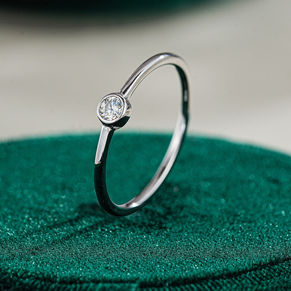 Simple round moissanite ring