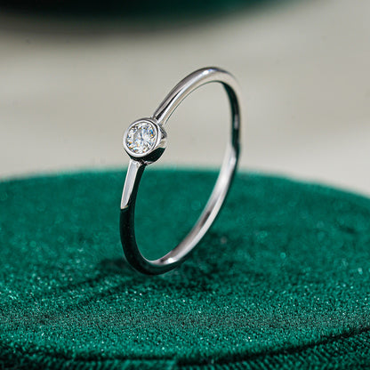 Simple round moissanite ring
