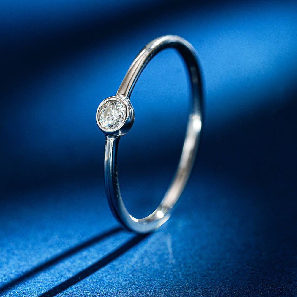 Simple round moissanite ring