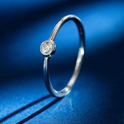 Simple round moissanite ring