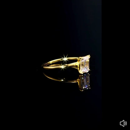 Emerald cut glossy moissanite ring